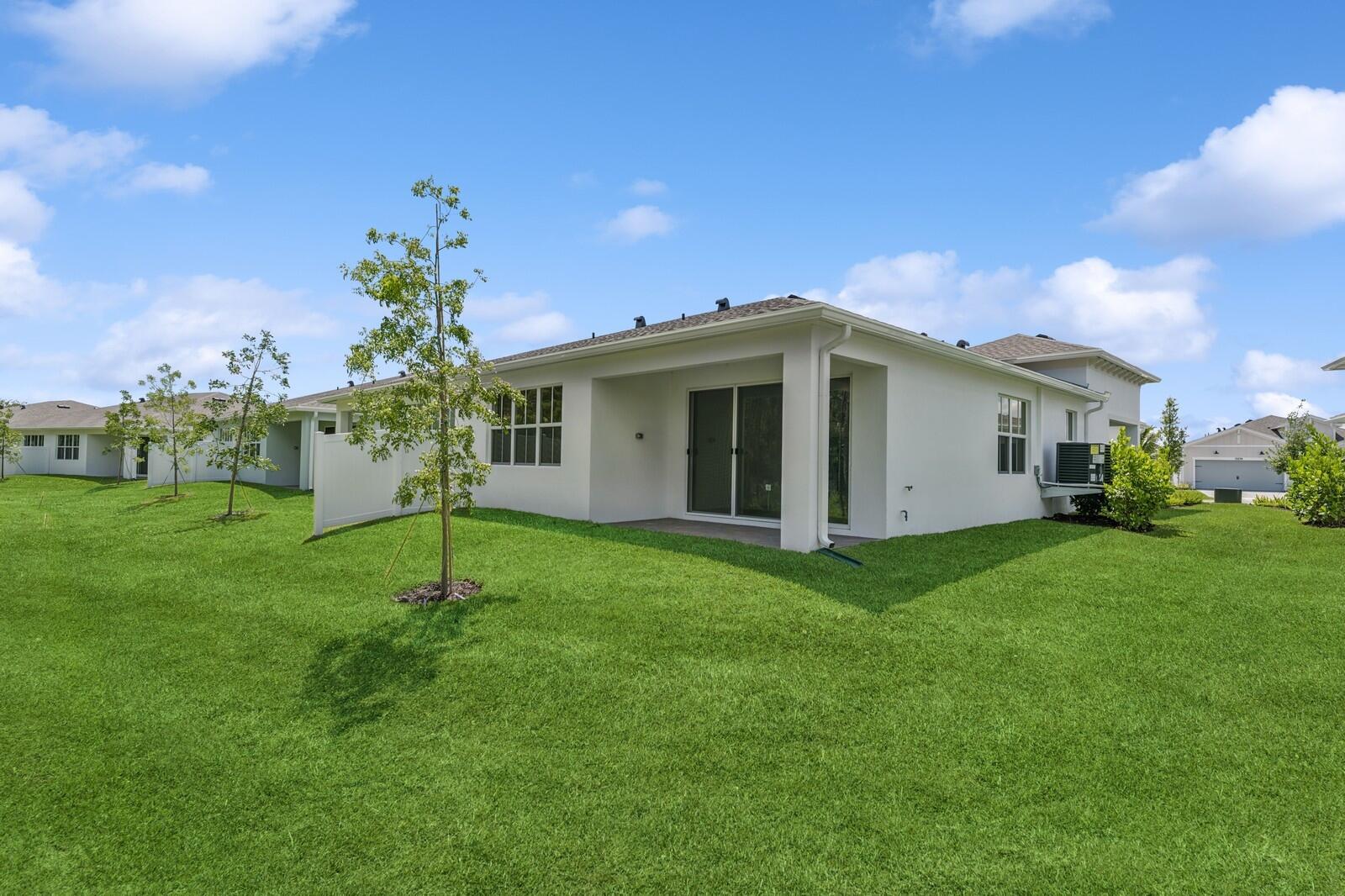 10259 Dreamweaver Road, Unit 31 Port St. Lucie, FL 34987 - Photo 36 of 45 Backyard & Covered Patio