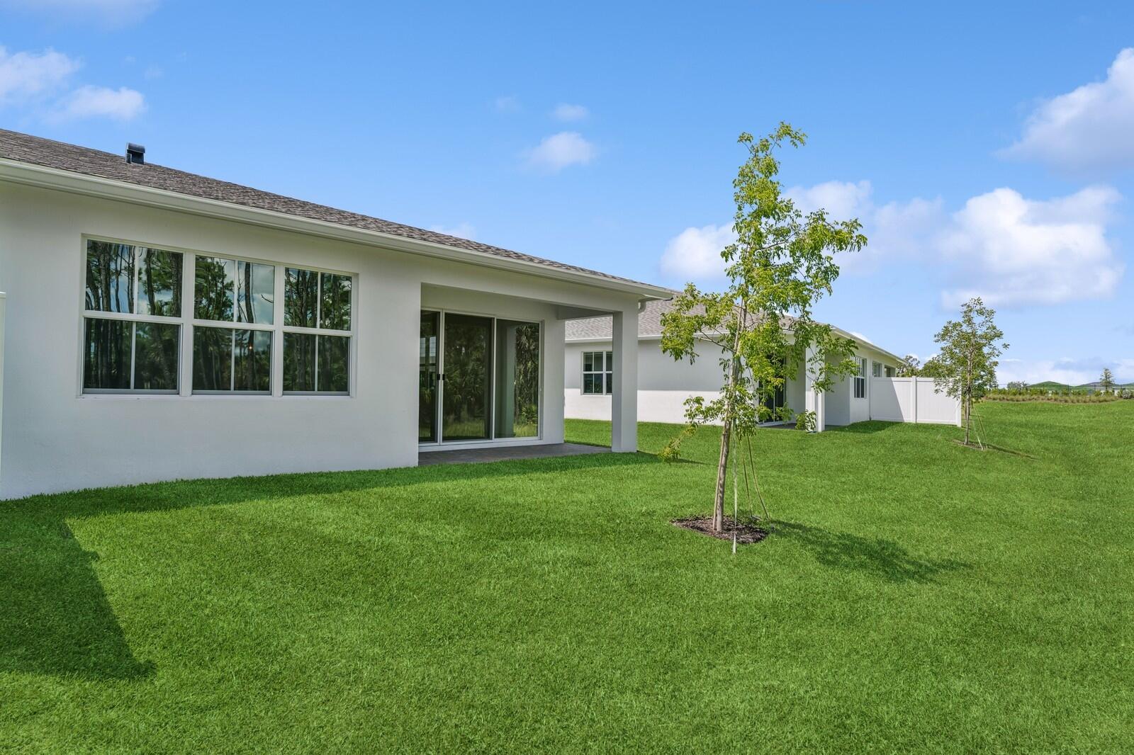 10259 Dreamweaver Road, Unit 31 Port St. Lucie, FL 34987 - Photo 38 of 45 Backyard & Covered Patio