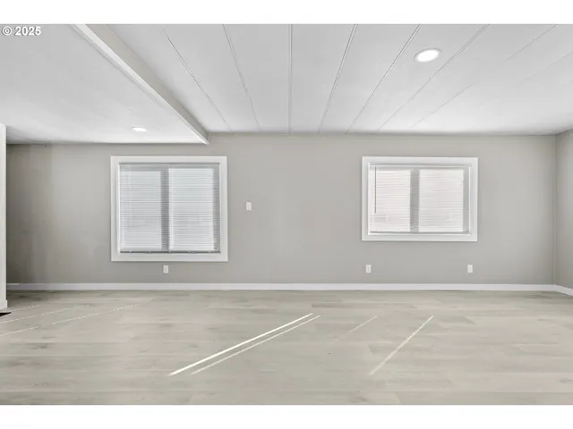 a view of empty room with windows