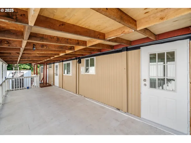 a view of a room with wooden walls