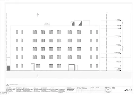 a black and white photo of a black white building