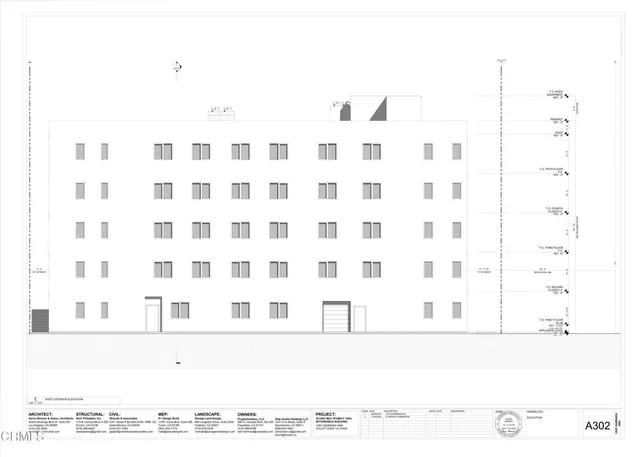 a black and white photo of a black white building