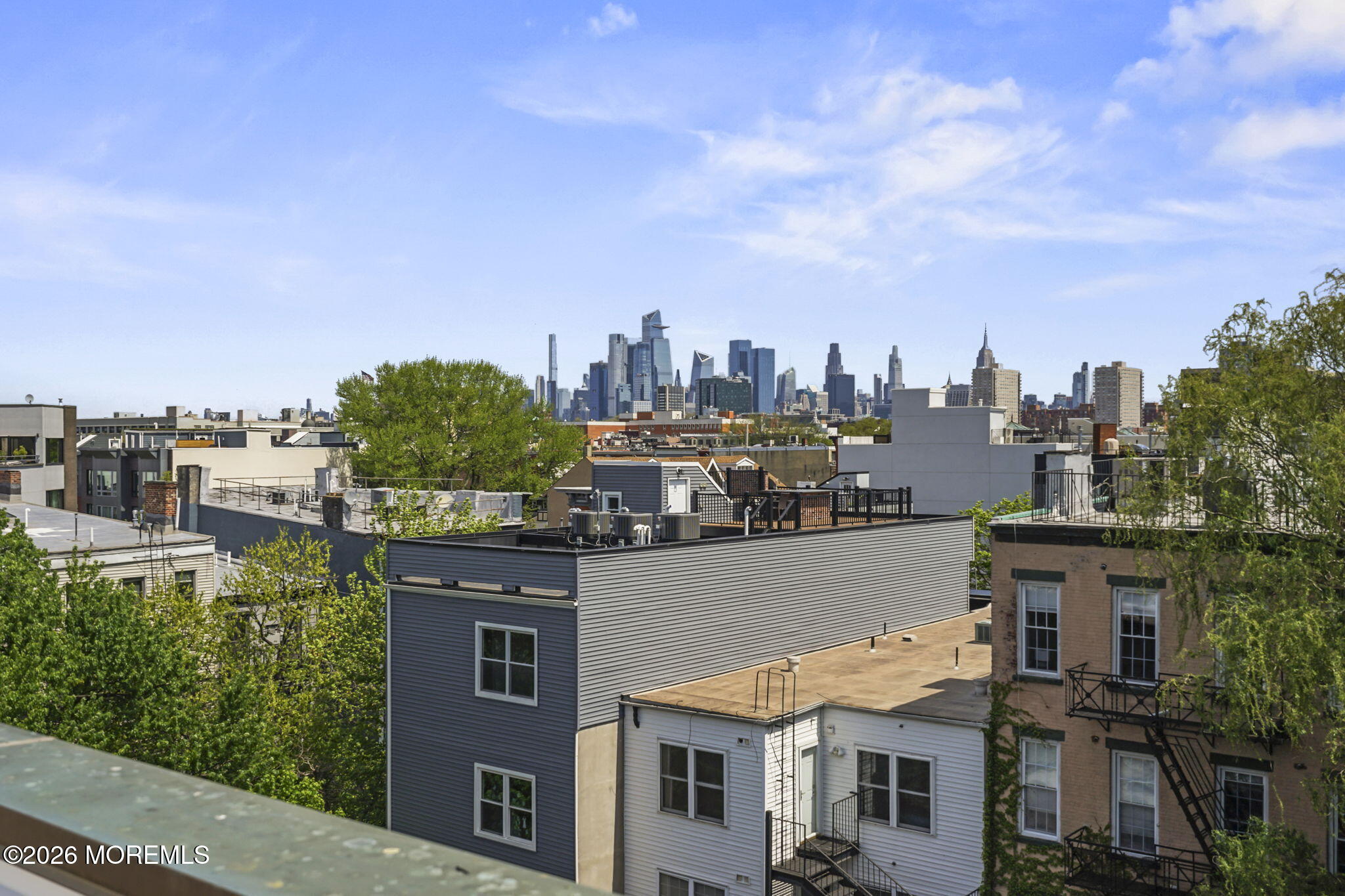 87 Jackson Street, Unit 4B Hoboken, NJ 07030 - Photo 23 of 29 NYC skyline view from terrace