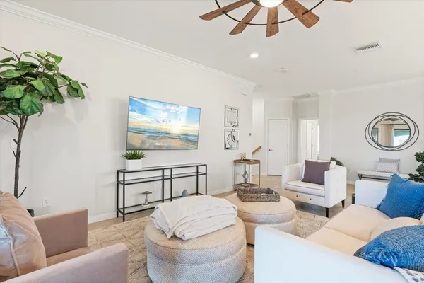 a view of a balcony with furniture and a floor to ceiling window