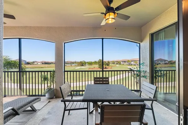 a bedroom with a large bed couch and a window