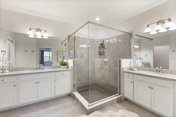 a living room with a bed furniture and a window