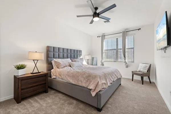 a view of a big room with a big yard and large trees