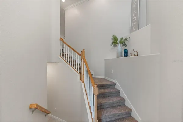 a living room with furniture and a painting on the wall