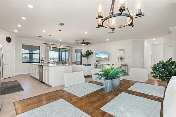 a kitchen with sink and chandelier