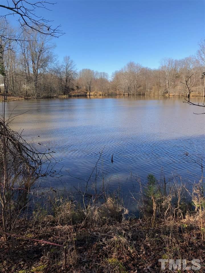 238 Dustin Lane Roxboro, NC 27574 - Photo 22 of 23 a view of lake with mountain in background