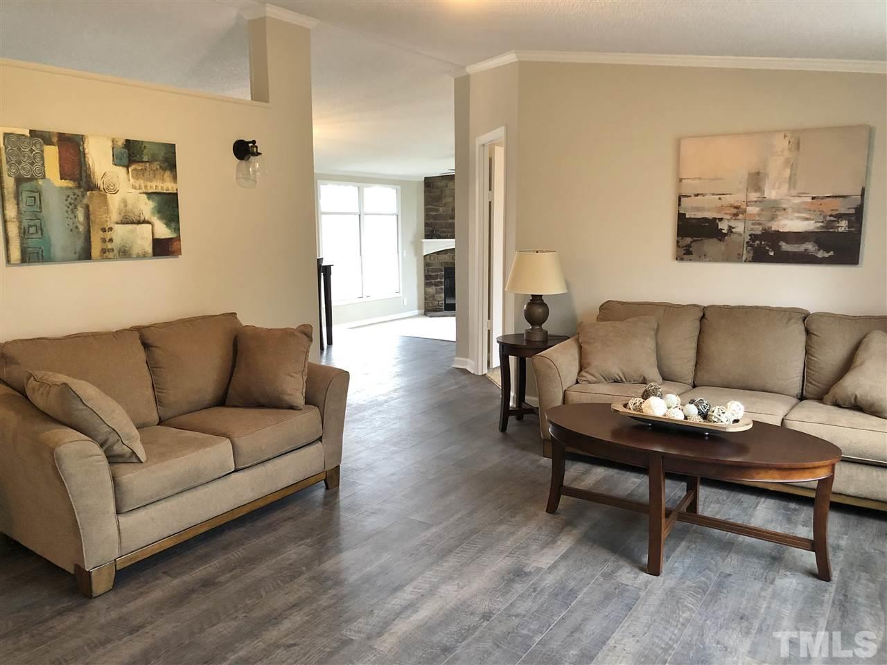 238 Dustin Lane Roxboro, NC 27574 - Photo 7 of 23 a living room with furniture and a wooden floor