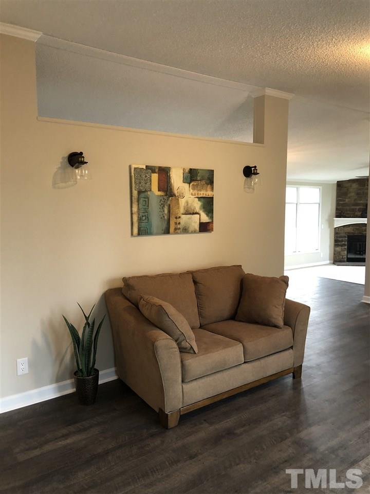 238 Dustin Lane Roxboro, NC 27574 - Photo 8 of 23 a living room with furniture and a wooden floor
