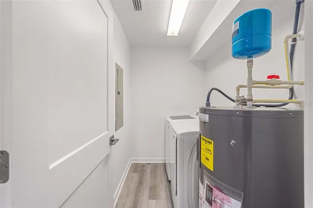 a room with a sink and a mirror