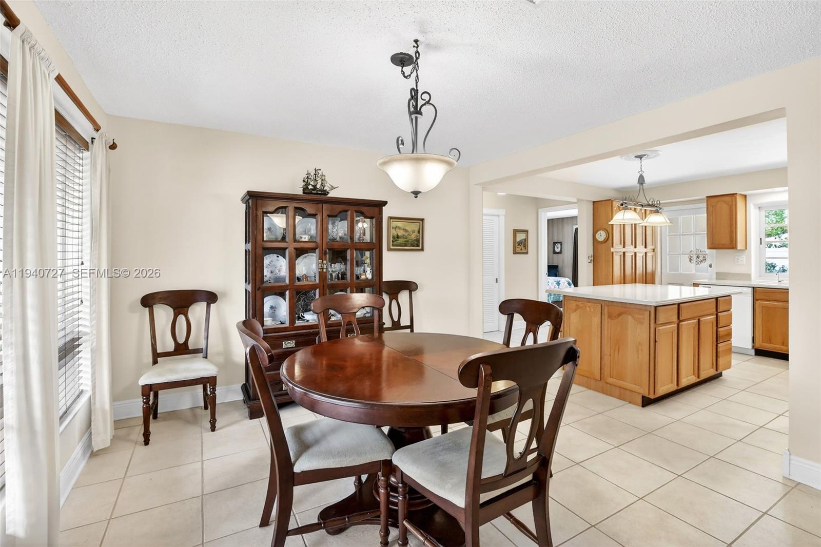 280 Southwest 63rd Avenue Plantation, FL 33317 - Photo 12 of 53 a dining room with furniture and window