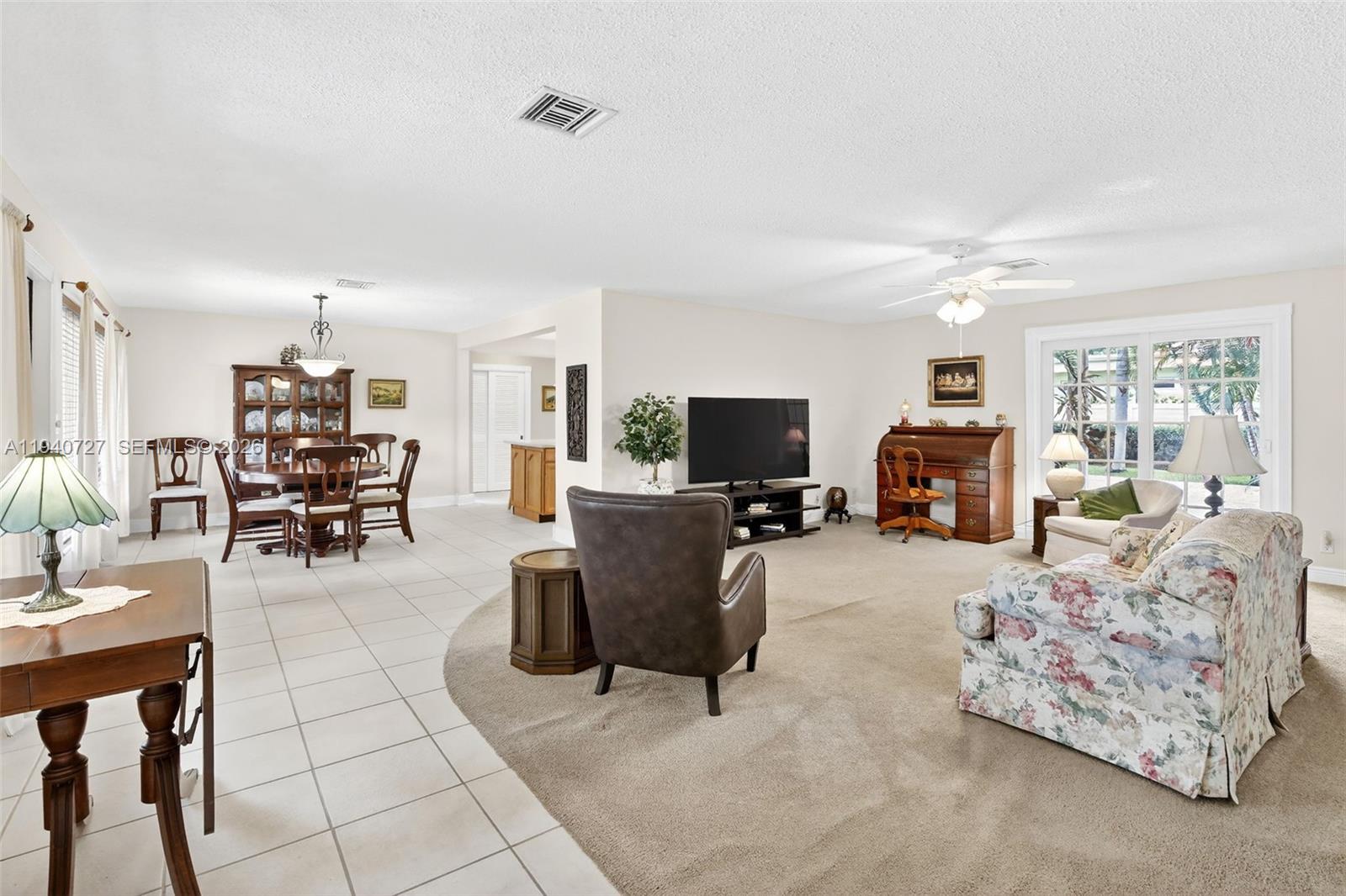 280 Southwest 63rd Avenue Plantation, FL 33317 - Photo 16 of 53 a living room with furniture and a flat screen tv