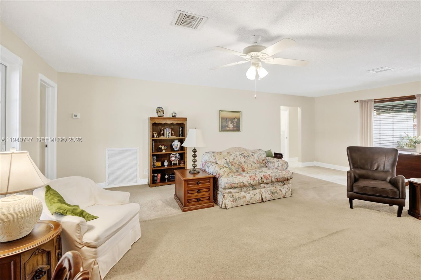 280 Southwest 63rd Avenue Plantation, FL 33317 - Photo 18 of 53 a living room with furniture and a chandelier