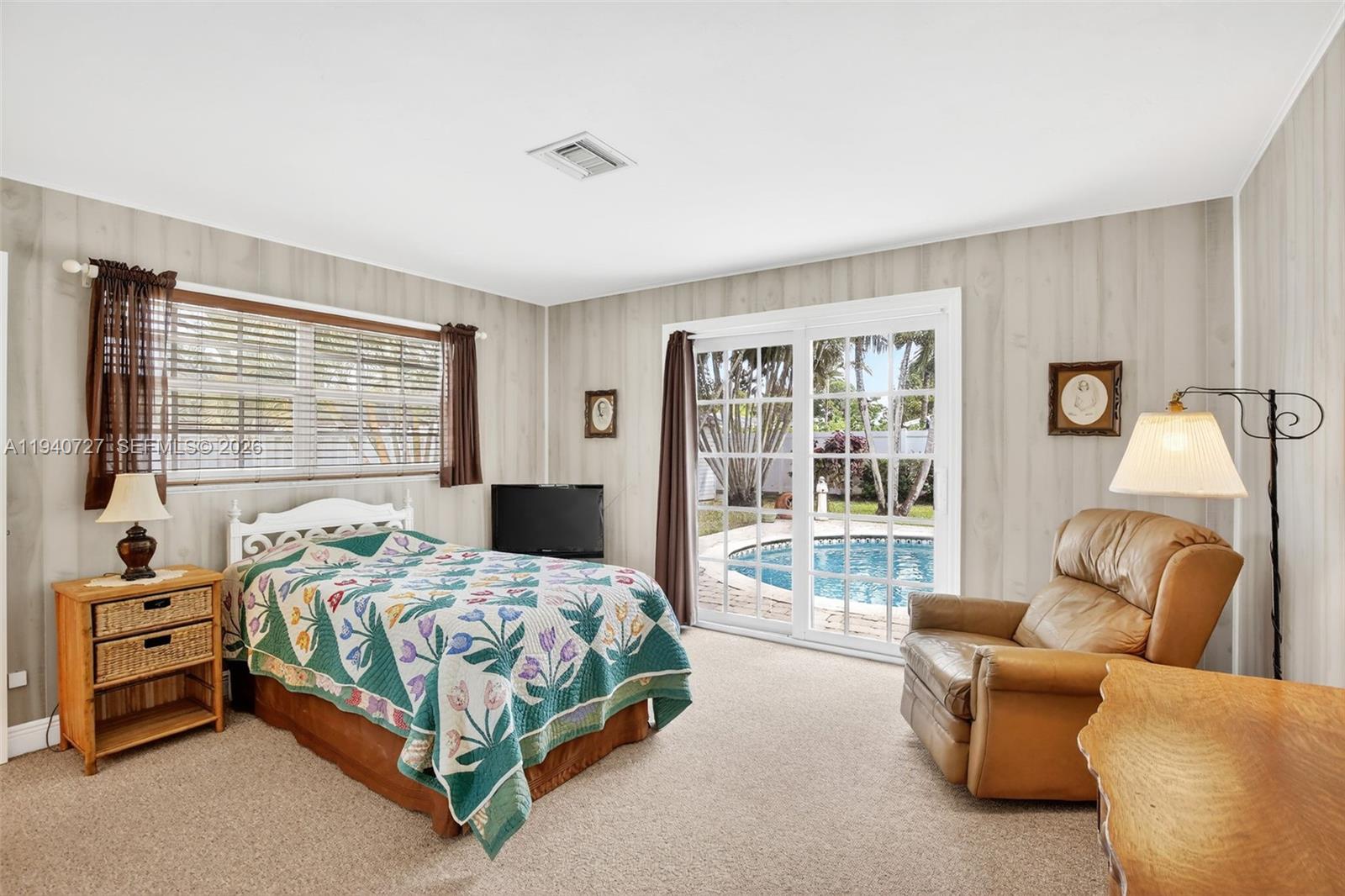 280 Southwest 63rd Avenue Plantation, FL 33317 - Photo 19 of 53 a bedroom with furniture and a large window