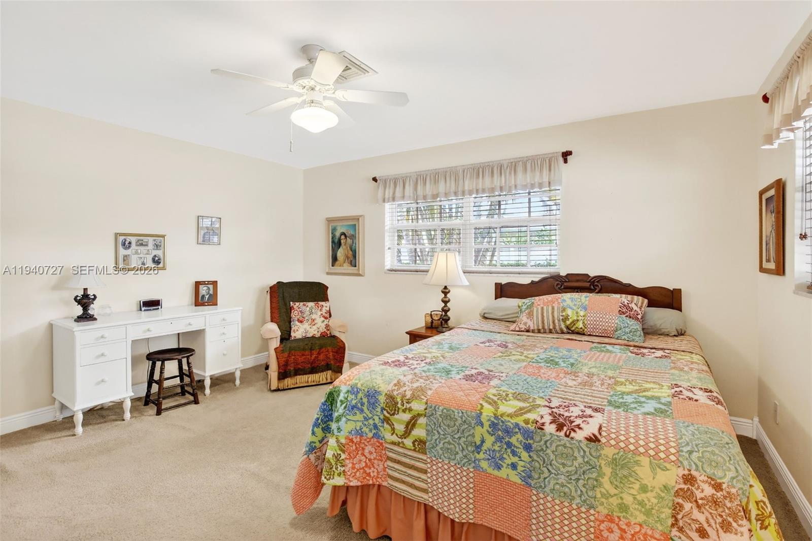 280 Southwest 63rd Avenue Plantation, FL 33317 - Photo 25 of 53 a bedroom with a bed and a chandelier