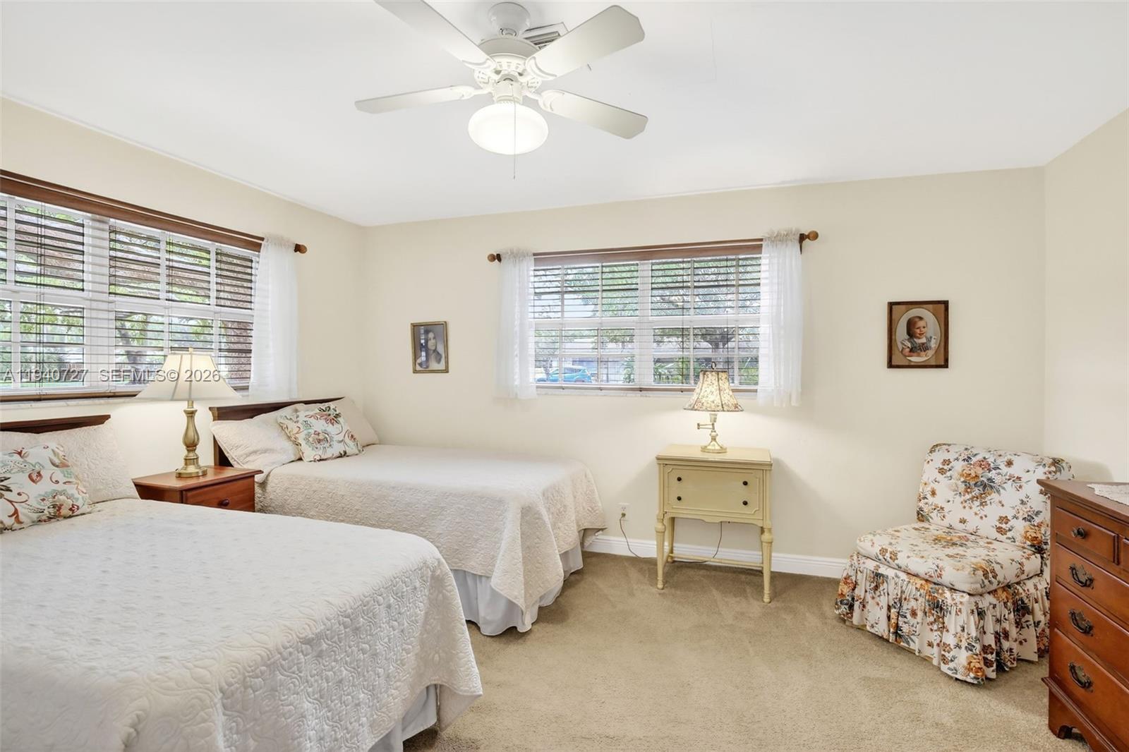 280 Southwest 63rd Avenue Plantation, FL 33317 - Photo 28 of 53 a bedroom with two beds and a large window