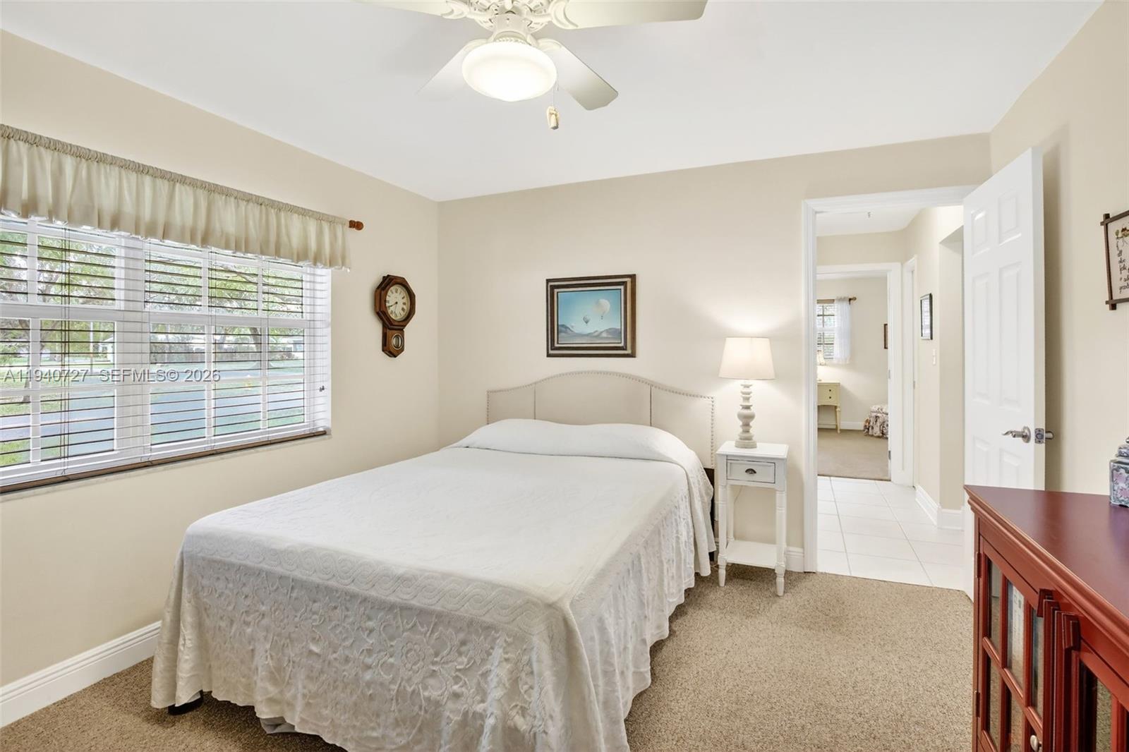 280 Southwest 63rd Avenue Plantation, FL 33317 - Photo 30 of 53 a bedroom with a bed and a large window