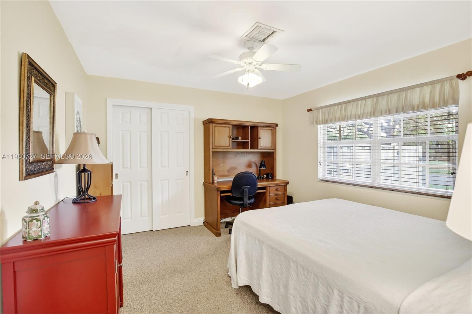 280 Southwest 63rd Avenue Plantation, FL 33317 - Photo 31 of 53 a bedroom with a bed and wooden floor