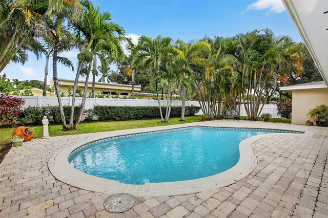 a view of swimming pool with a yard