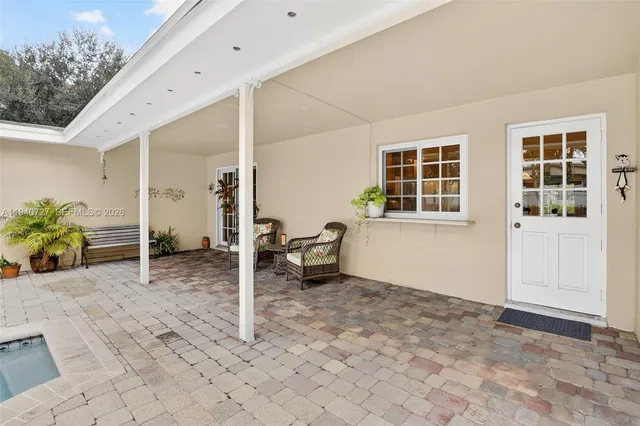 a front view of house with yard and trees