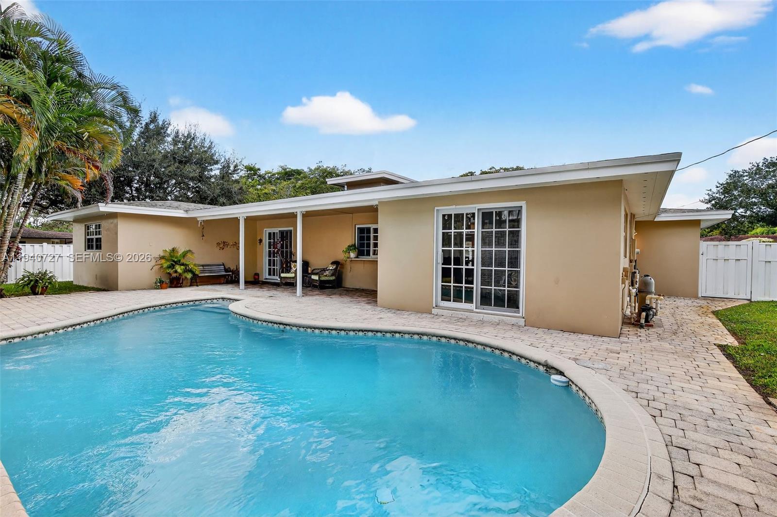 280 Southwest 63rd Avenue Plantation, FL 33317 - Photo 5 of 53 a view of a house with swimming pool and sitting area