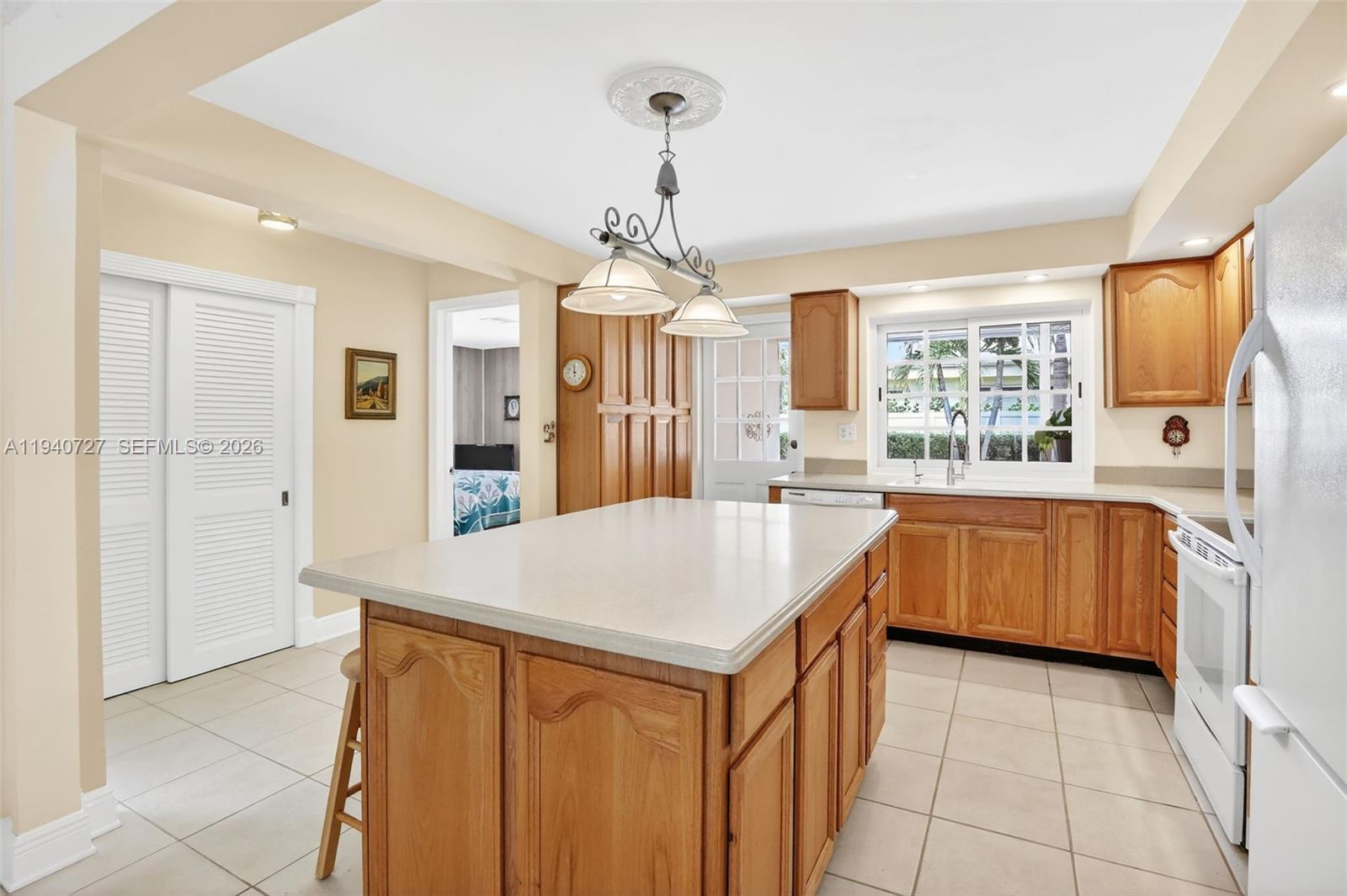 280 Southwest 63rd Avenue Plantation, FL 33317 - Photo 10 of 53 a kitchen that has a lot of cabinets in it