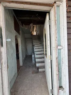 a view of entryway with stairs and furniture