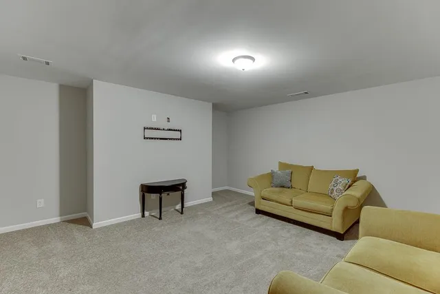 a living room with furniture and a couch