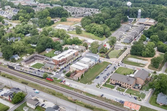 an aerial view of residential houses with outdoor space