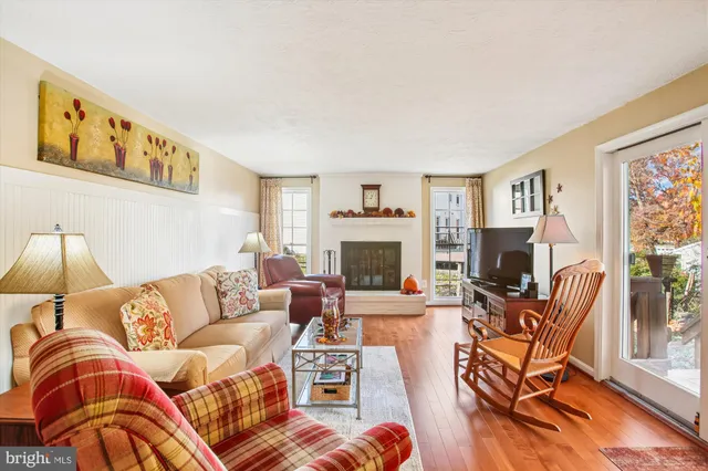 a living room with furniture fireplace and a flat screen tv
