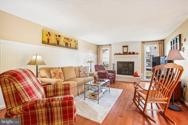 a living room with furniture fireplace and a fireplace