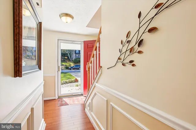a view of an entryway with wooden floor