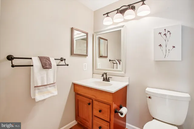 a bathroom with a shower curtain and a toilet