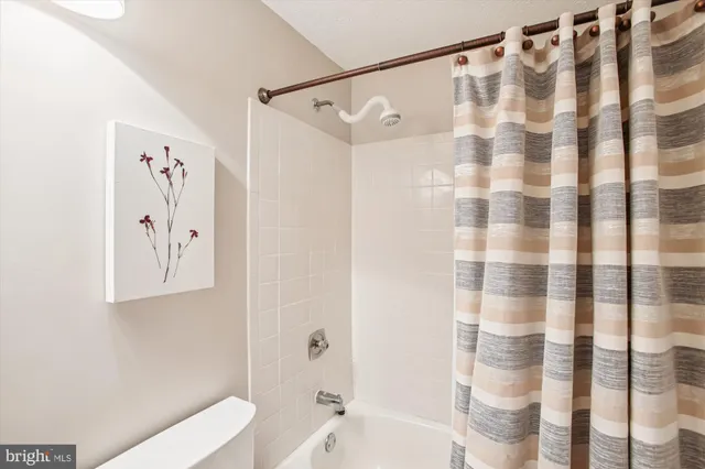 a view of a balcony with chairs and wooden floor