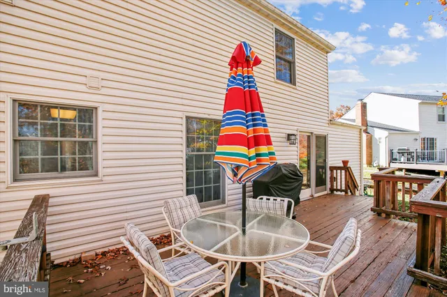 a view of a chairs and table in the backyard