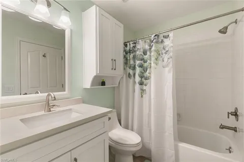 a bathroom with a sink a toilet and a bathtub
