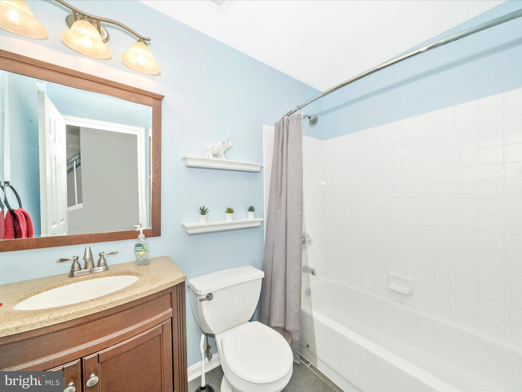 514 Ellison Court Frederick, MD 21703 - Photo 11 of 53 a bathroom with a granite countertop sink toilet and shower