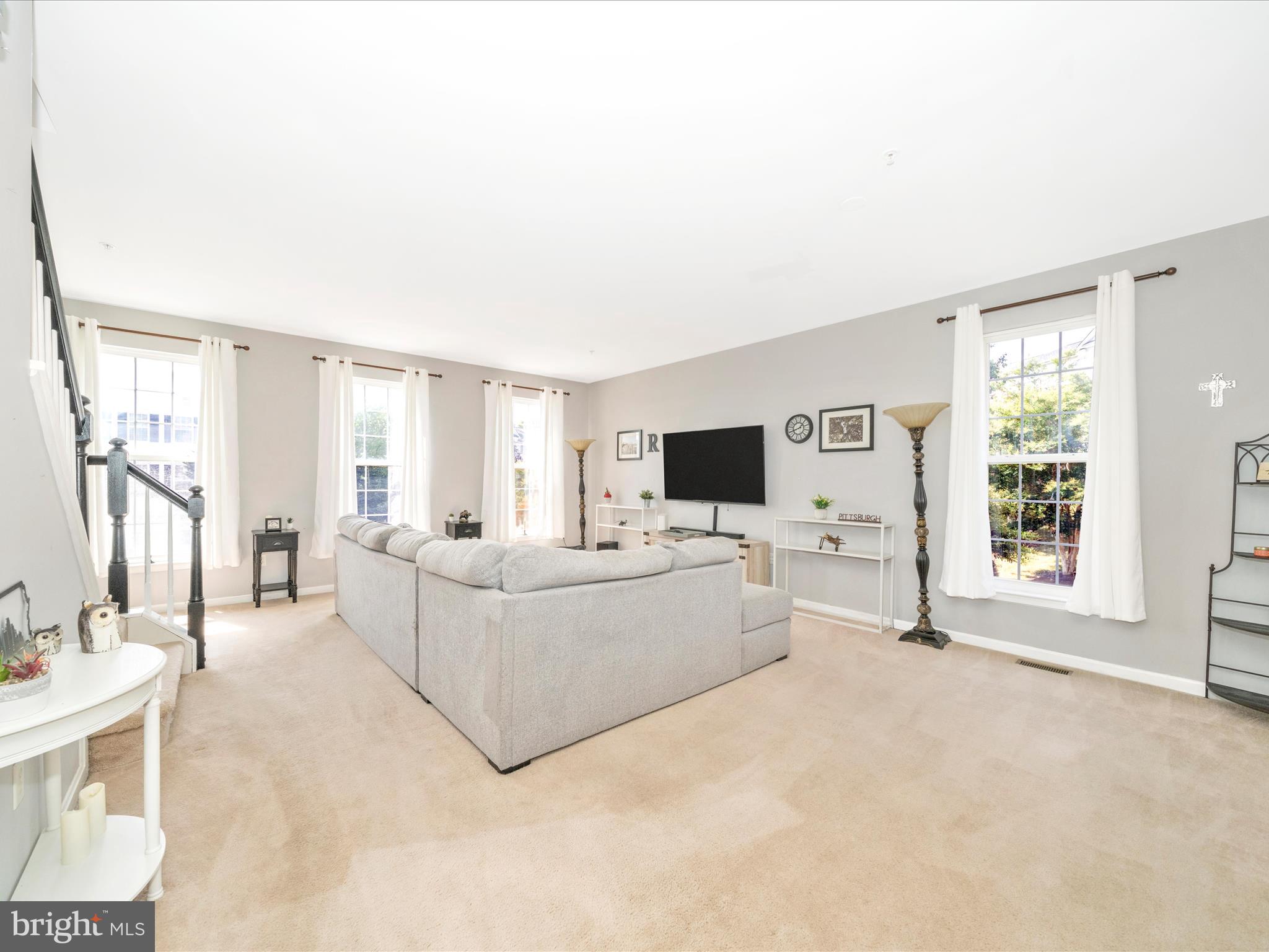 514 Ellison Court Frederick, MD 21703 - Photo 13 of 53 a living room with furniture and a flat screen tv