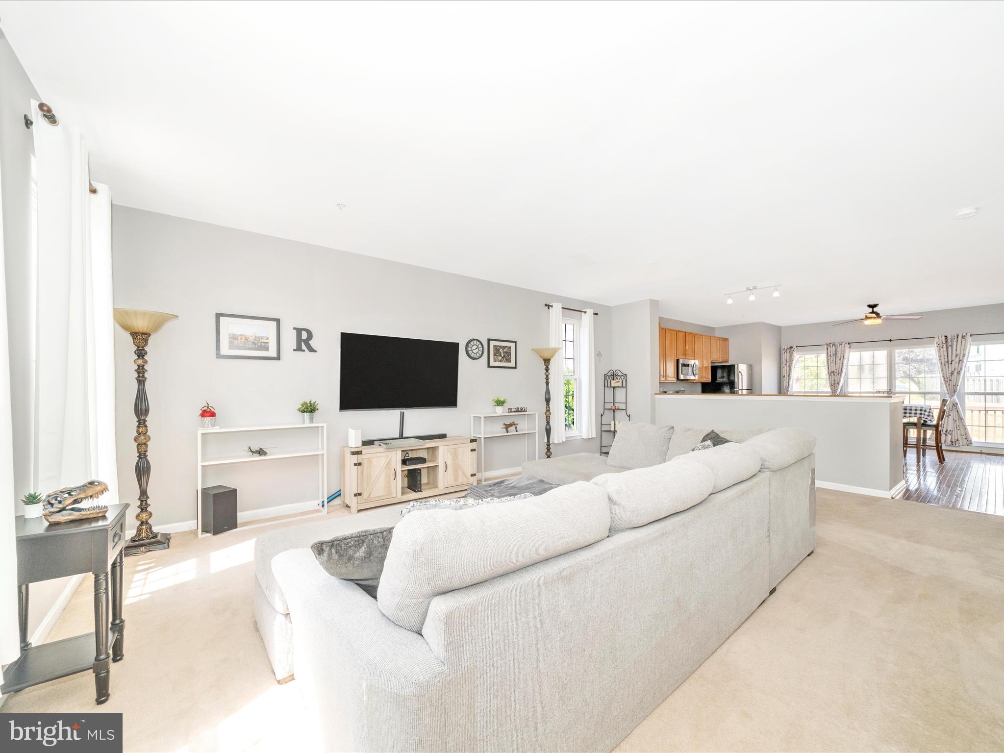 514 Ellison Court Frederick, MD 21703 - Photo 14 of 53 a living room with furniture and a flat screen tv