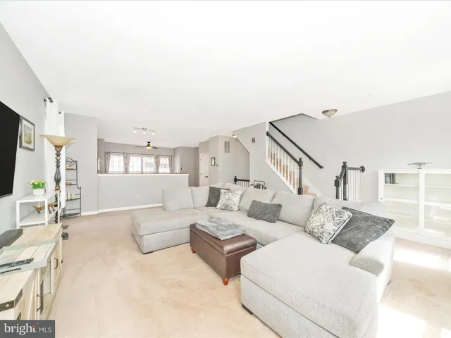 a kitchen with stainless steel appliances granite countertop a refrigerator a stove and a sink with cabinets