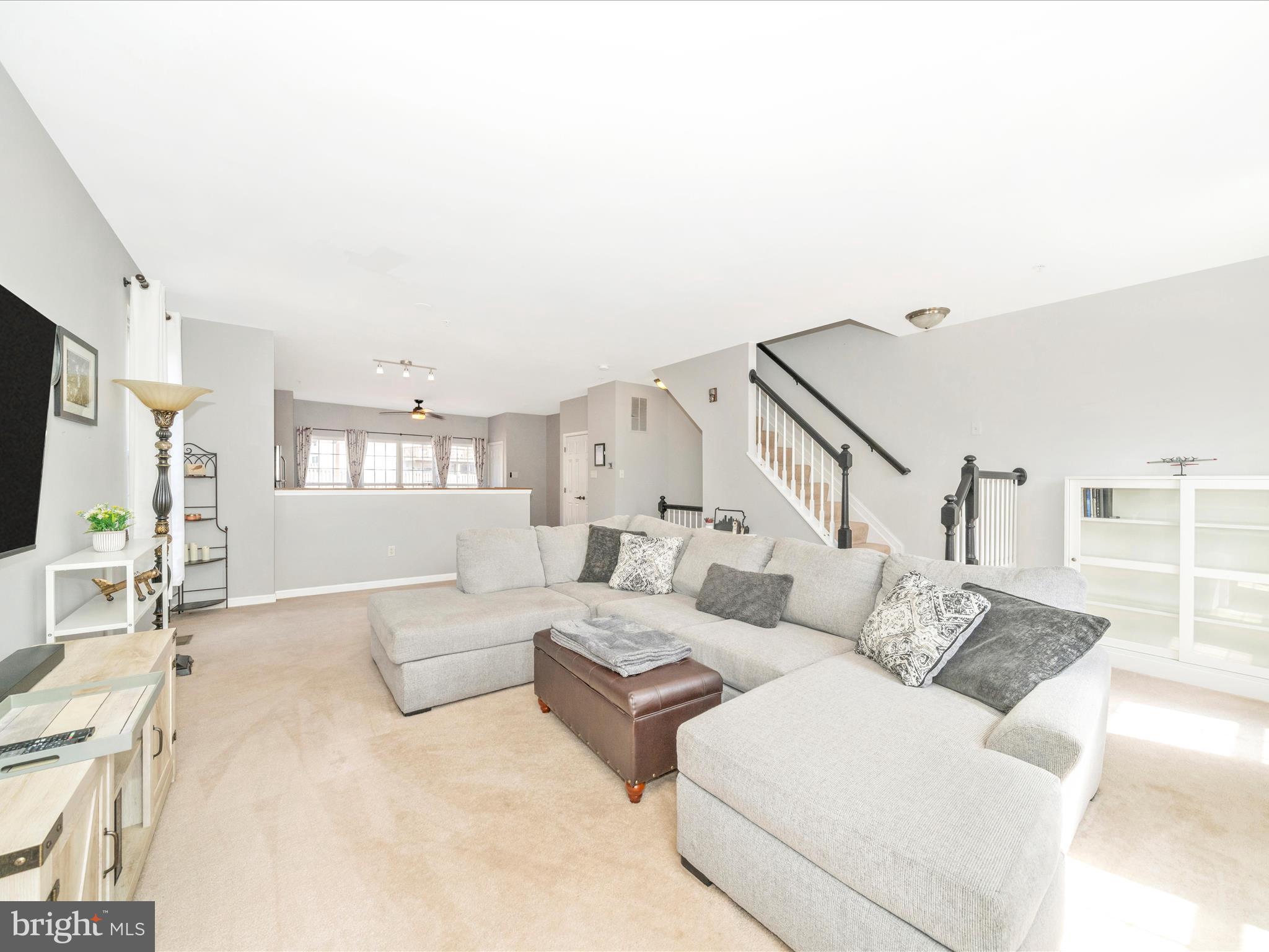514 Ellison Court Frederick, MD 21703 - Photo 15 of 53 a living room with furniture and a flat screen tv