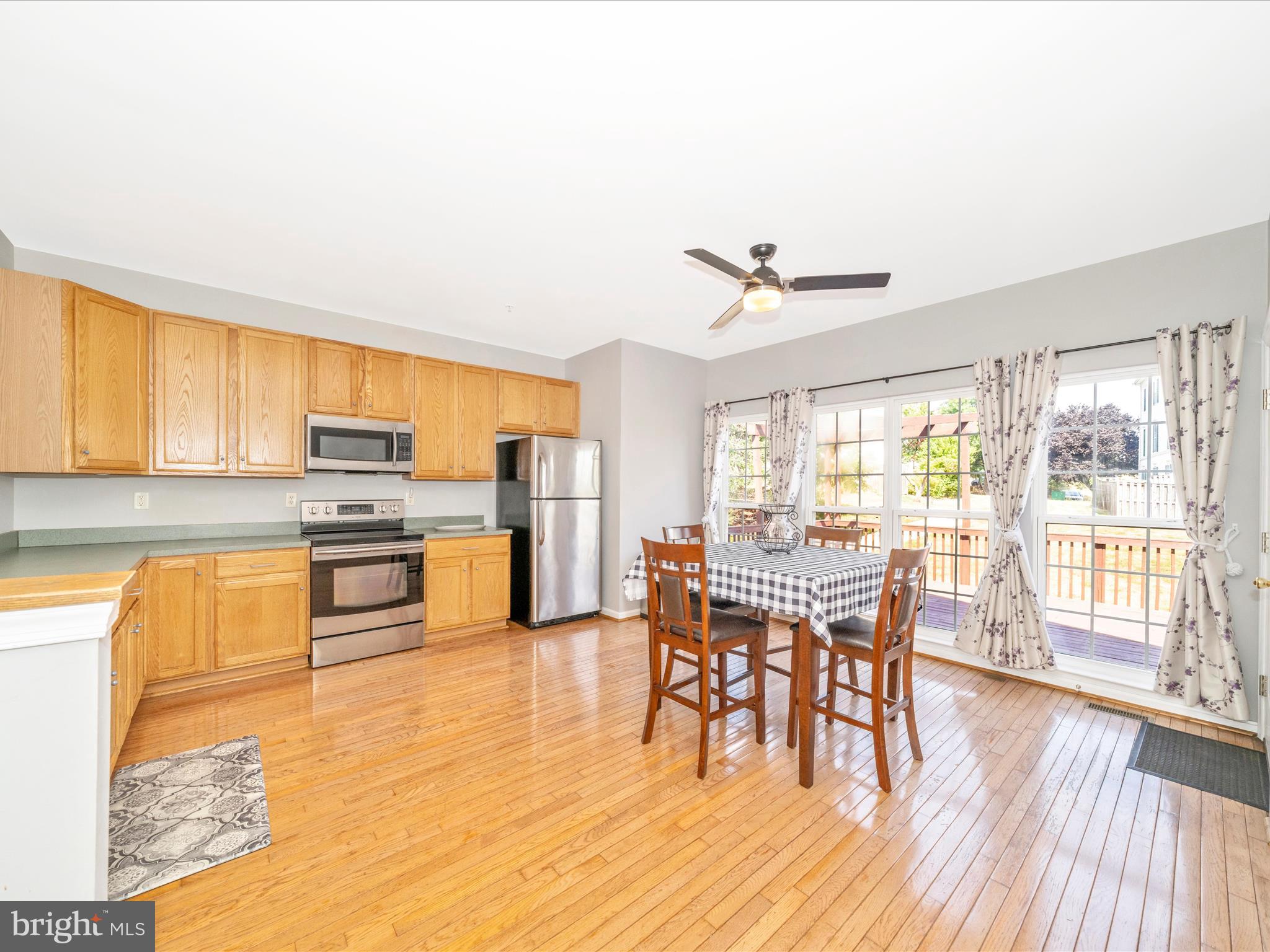 514 Ellison Court Frederick, MD 21703 - Photo 22 of 53 a view of a dining room with furniture window and wooden floor