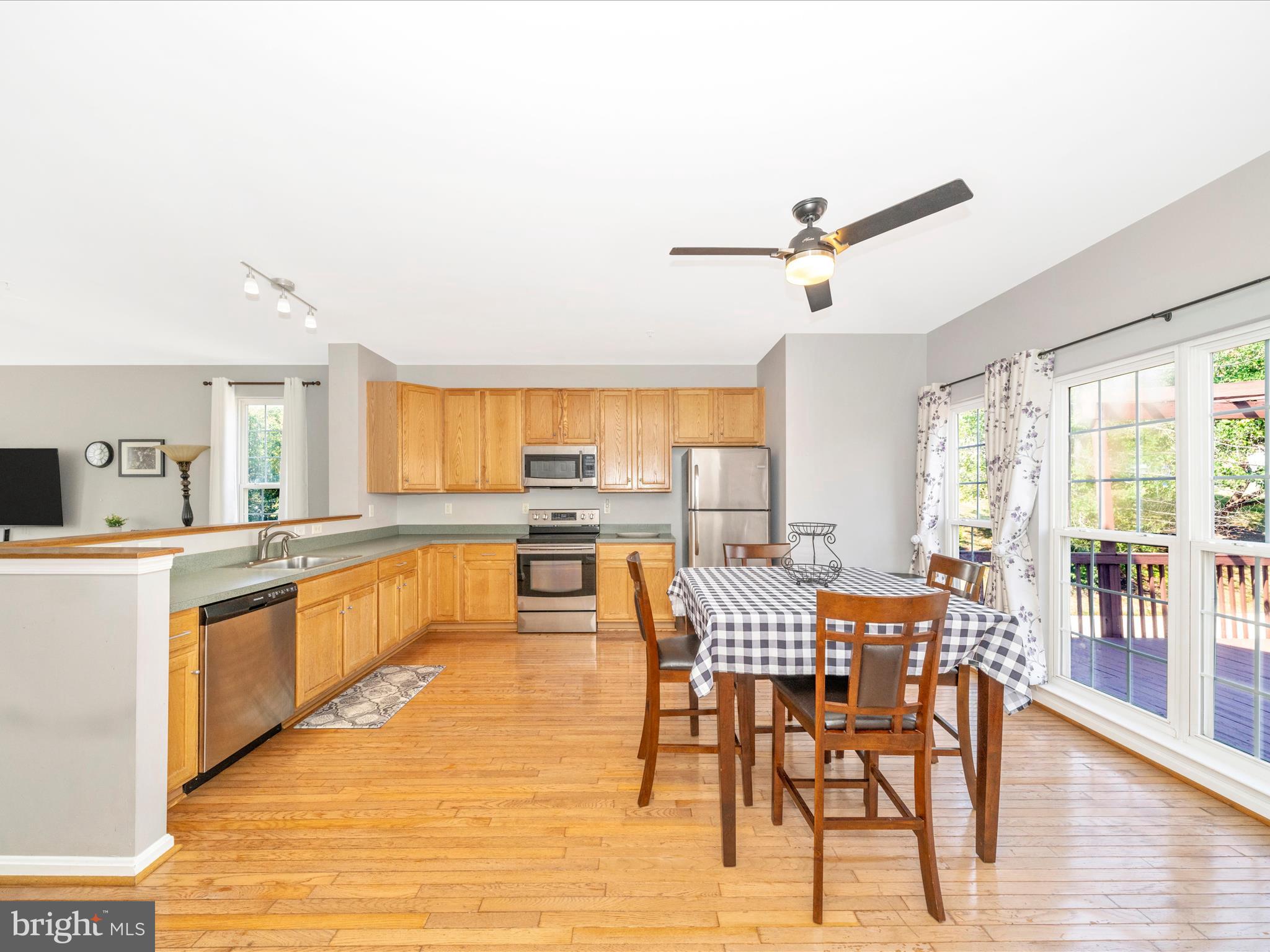 514 Ellison Court Frederick, MD 21703 - Photo 24 of 53 a view of a dining room with furniture window and wooden floor