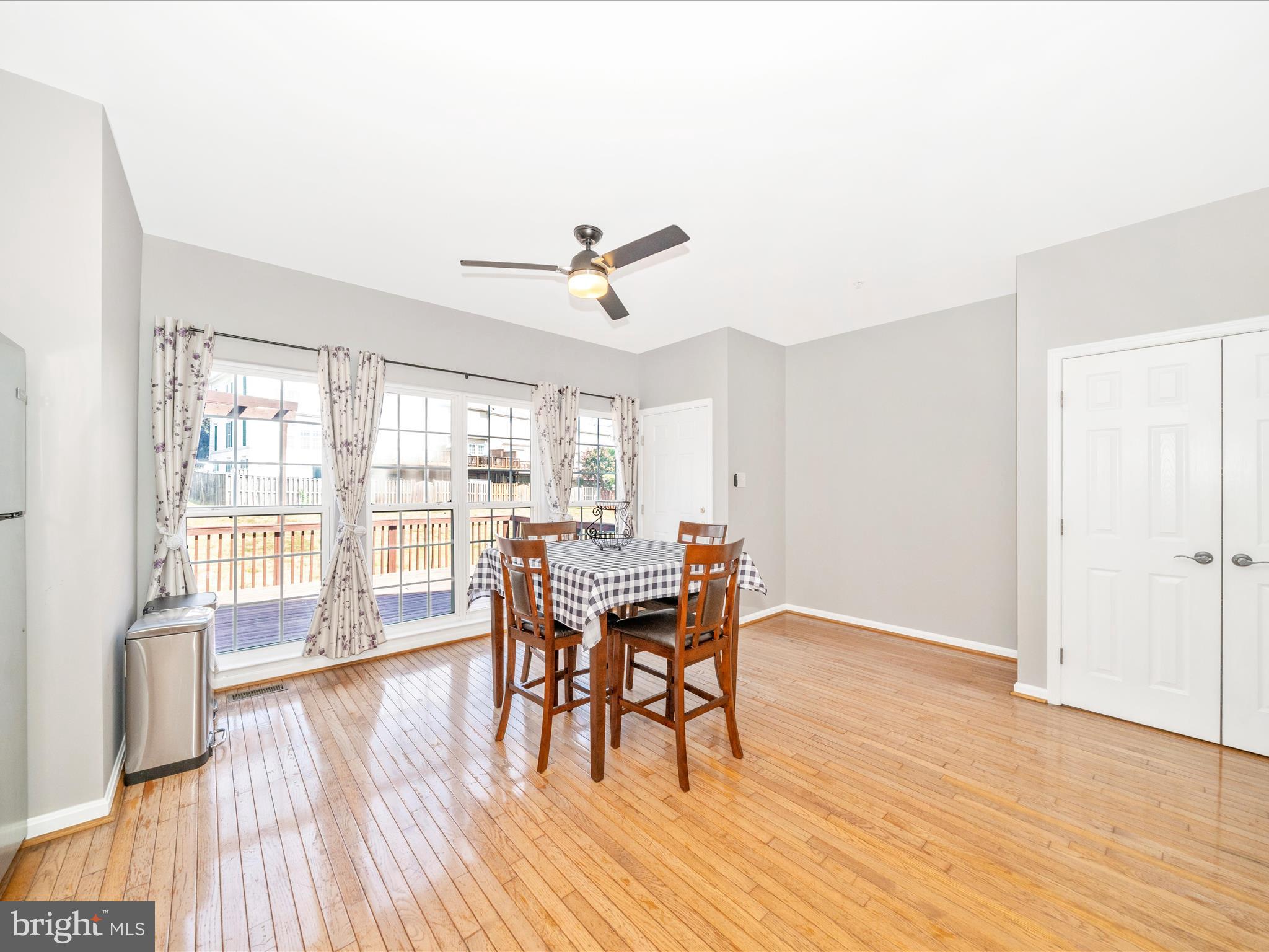 514 Ellison Court Frederick, MD 21703 - Photo 25 of 53 a view of a dining room with furniture window and wooden floor