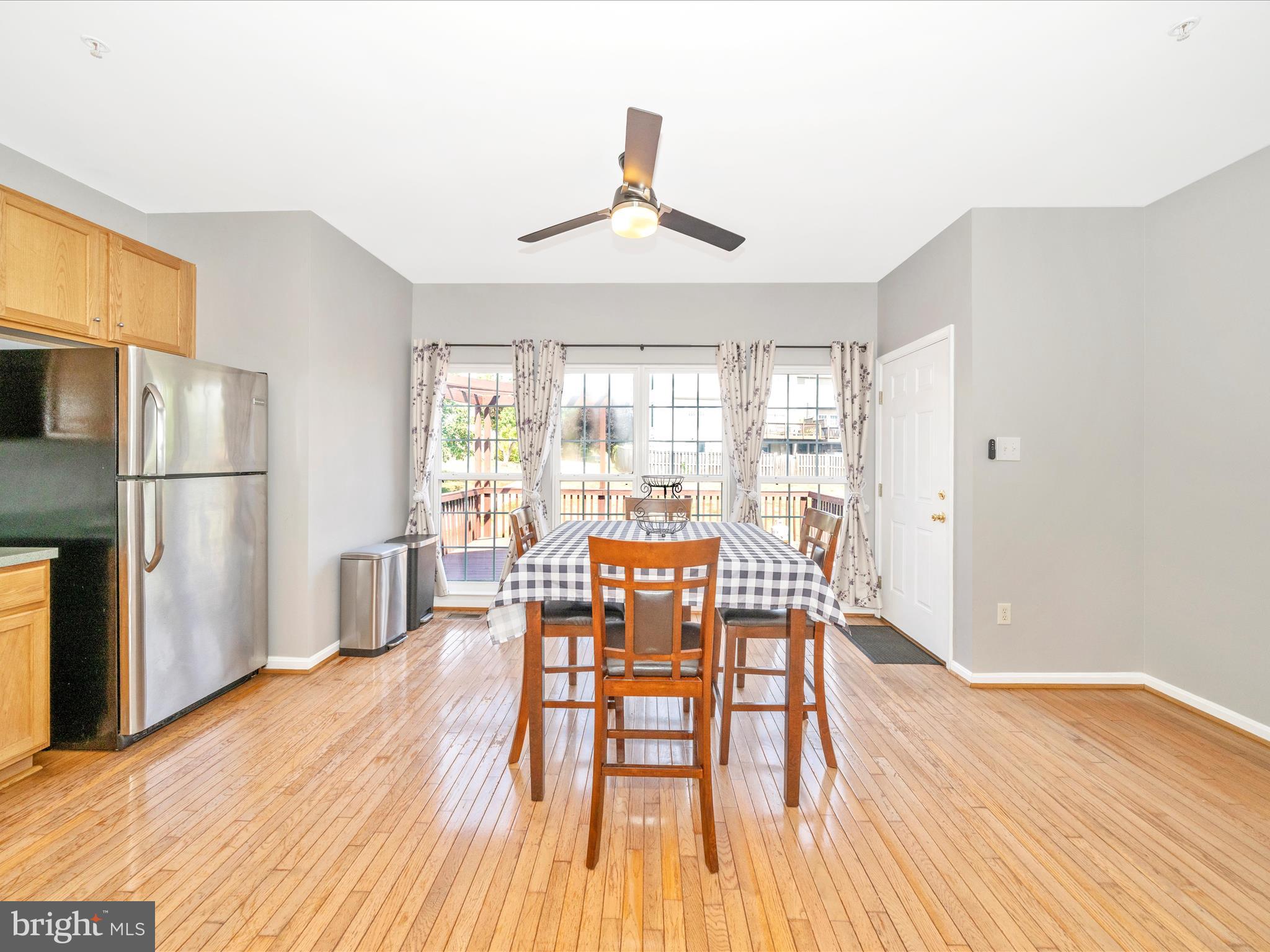 514 Ellison Court Frederick, MD 21703 - Photo 27 of 53 a view of a dining room with furniture window and wooden floor