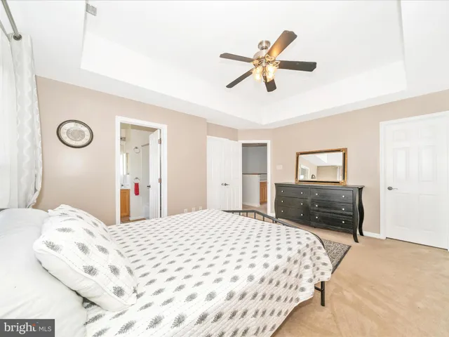 a bedroom with bed and window