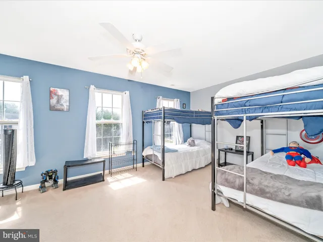 a bedroom with furniture and window